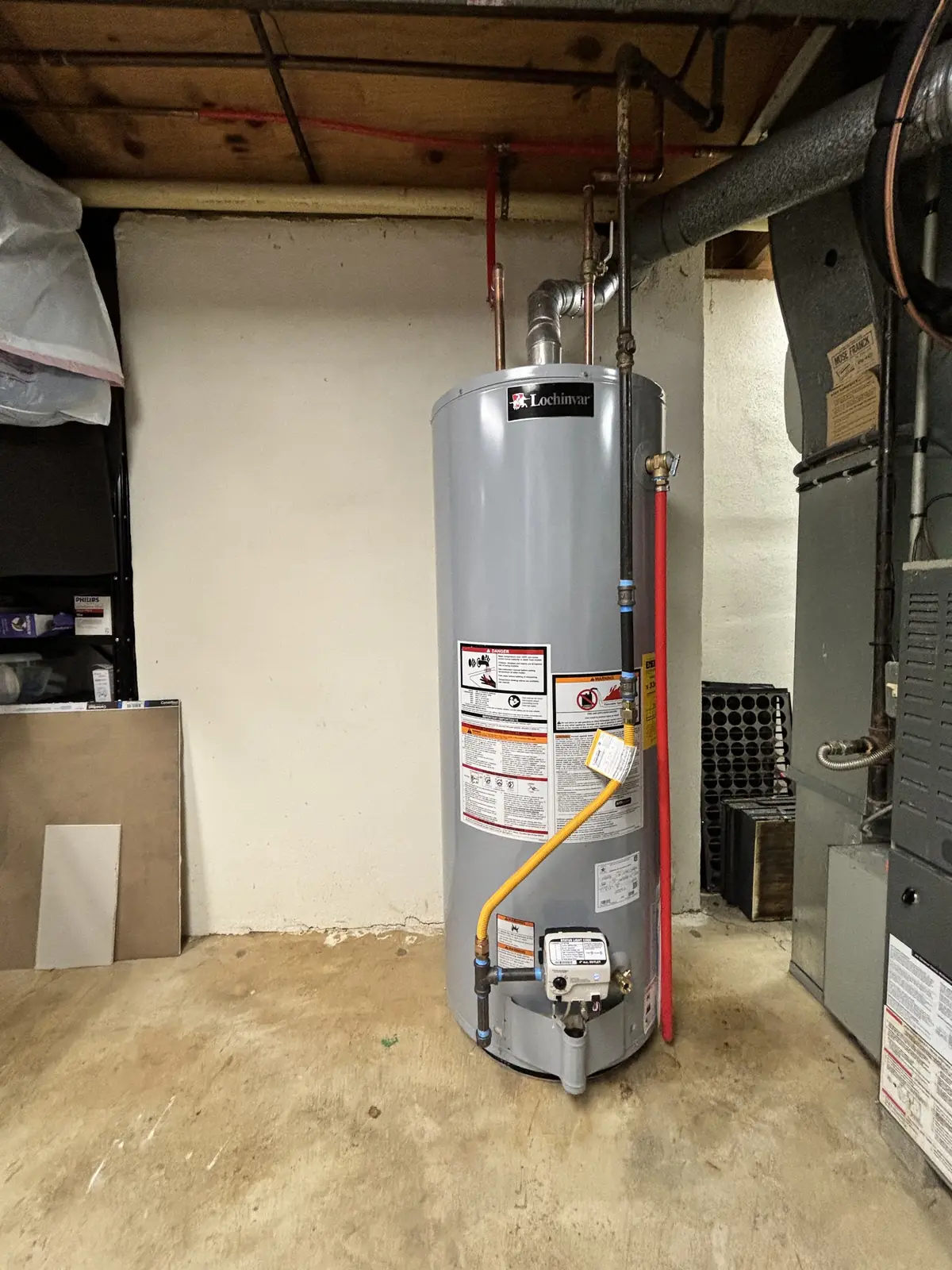 New Lochinvar gas water heater installed in a basement