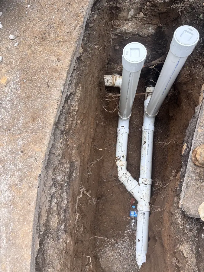 New PVC sewer line and cleanouts in an open trench